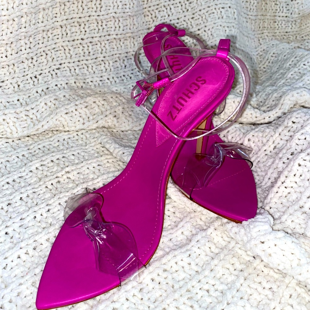 New with tags pink heels with clear strap and bow detail.